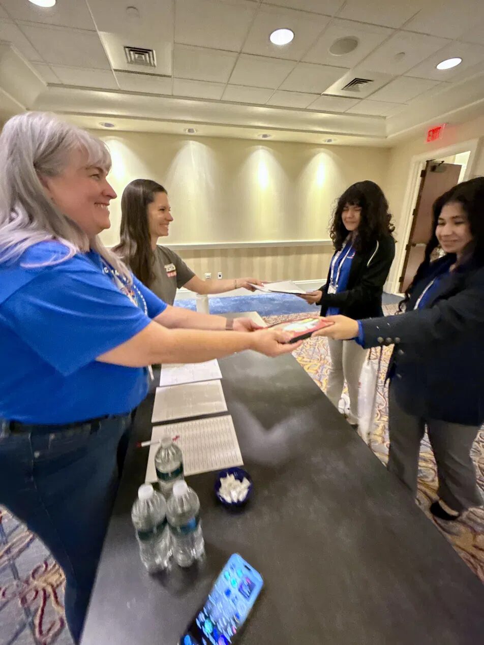 A Paul International student submits the Children's Stories team's project at the 2026 TSA National Conference.